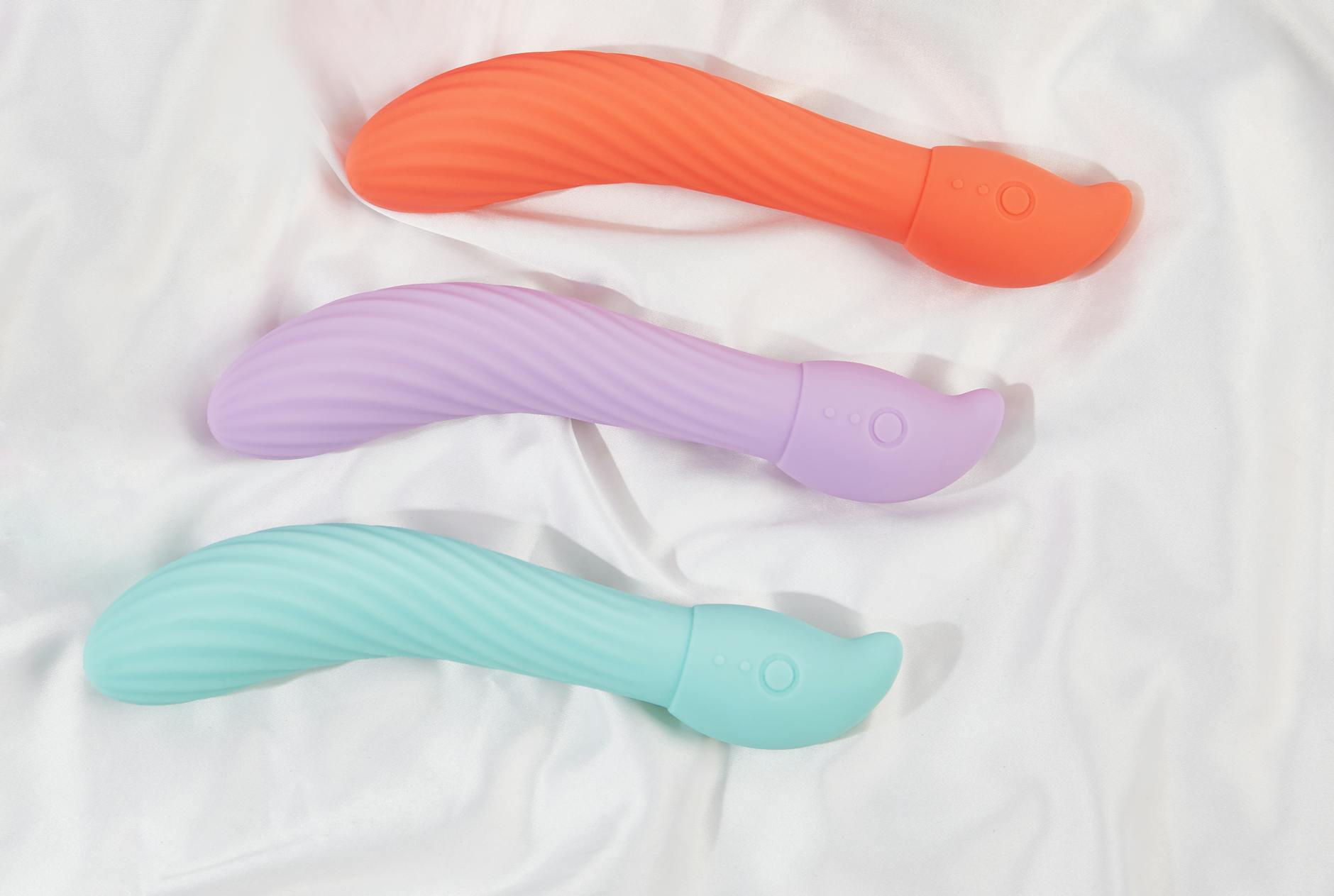 Two partners holding a vibrator together, representing openness and shared intimacy