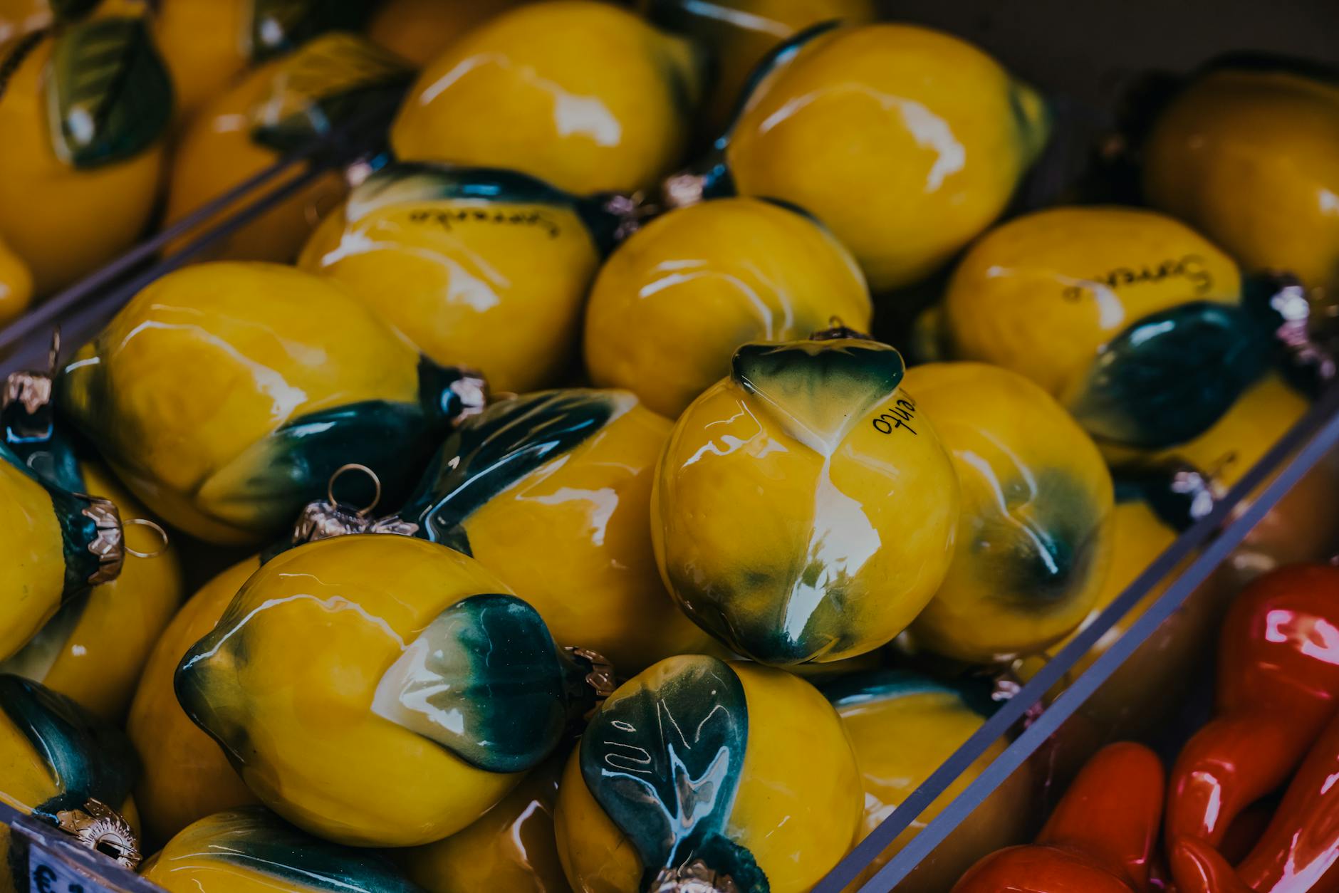 Vibrant yellow ceramic lemons artfully displayed, representing the energy and playfulness of the Lemon Sucker Shop experience