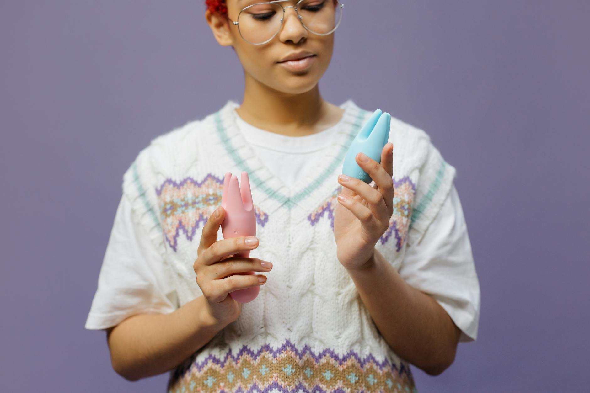 Woman holding a lemon clitoral vibrator in a thoughtful moment of reconnection